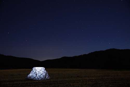 leisure activities photography of lighted tent on field sky